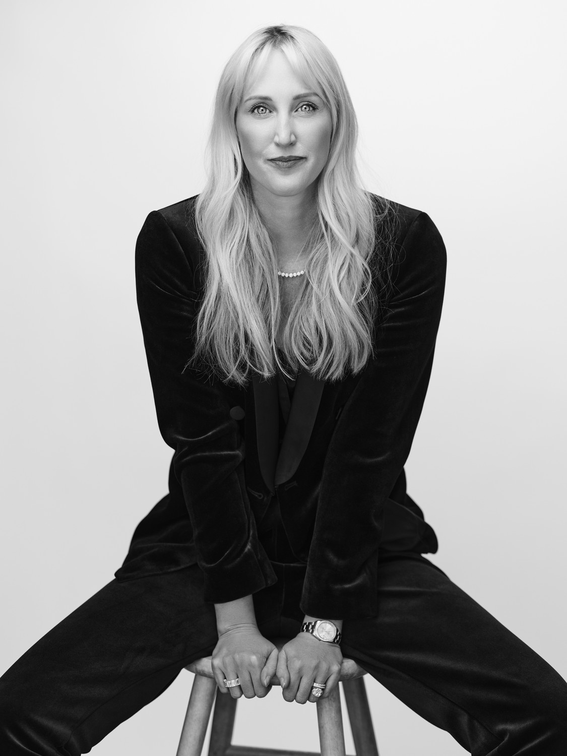 Lisa Zimowsky portrait — black velvet suit, direct gaze